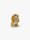 Charm Lady – Petite Chienne Dorée au Collier Bleu